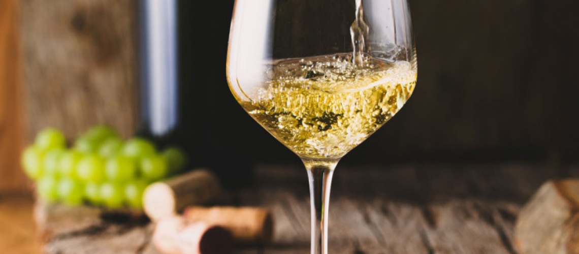 bigstock-Wine-Glass-Of-White-Wine-In-W-284151709_2